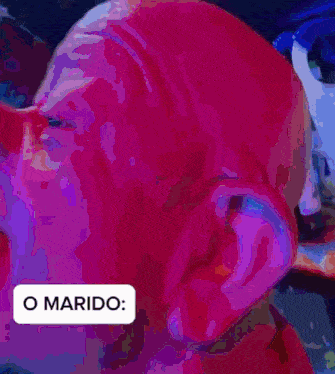 a close up of a person 's face with the words o marido on the bottom