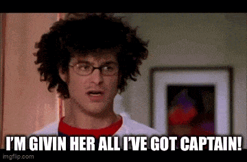 a man with curly hair and glasses is saying `` i 'm givin her all i 've got captain ''