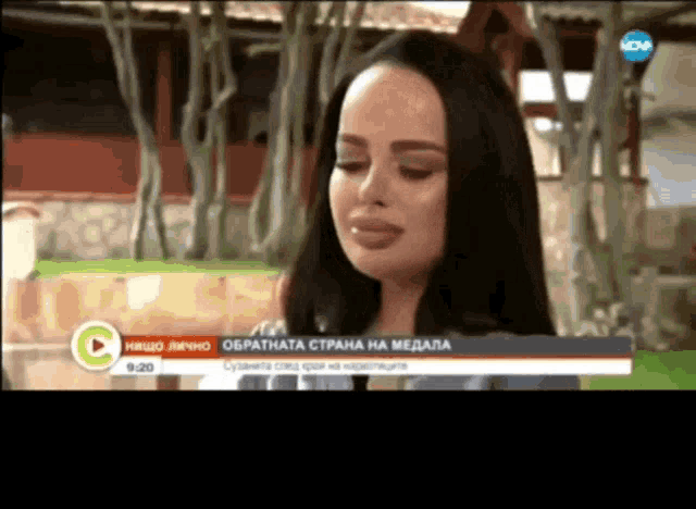 a woman is being interviewed on a tv channel with the time 9:20 on the screen