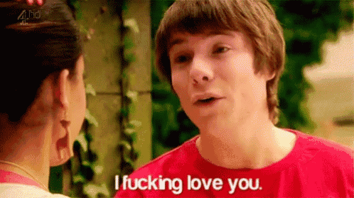a man in a red shirt is talking to a woman in a pink shirt and saying i fucking love you .