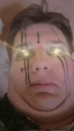 a close up of a person 's face with a cross painted on it