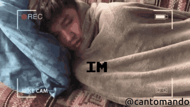 a video of a person wrapped in a blanket says im