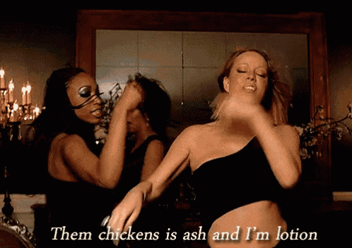 two women are dancing in front of a mirror with the words " them chickens is ash and i 'm lotion " above them