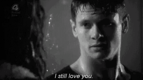 a black and white photo of a man and a woman with the caption " i still love you "