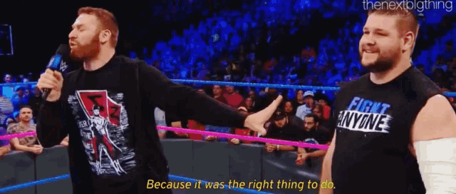 a man in a black shirt that says first anyone on it