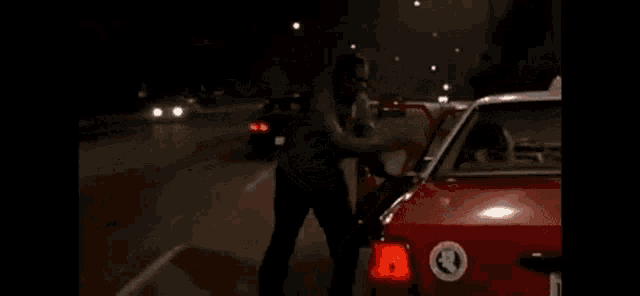 a red taxi cab with a license plate that says le499975