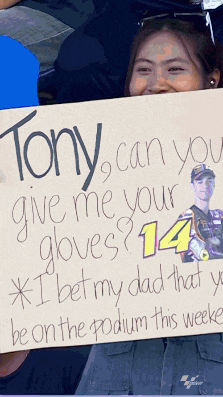 a woman holds a sign that says tony can you give me your gloves