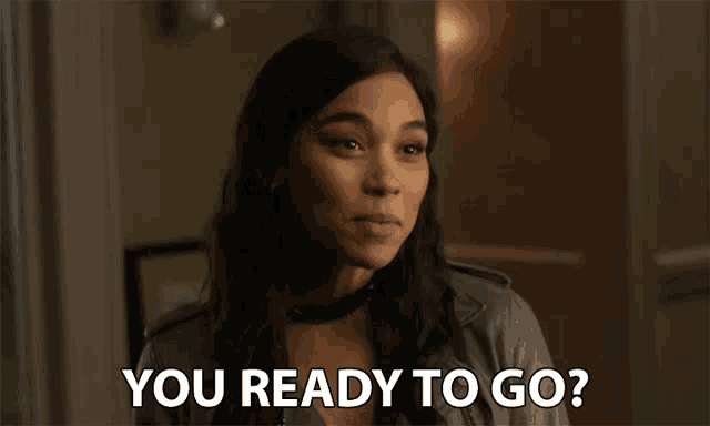 a woman says " you ready to go " while wearing a choker