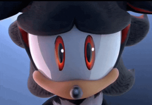 a close up of a shadow the hedgehog 's face with red eyes
