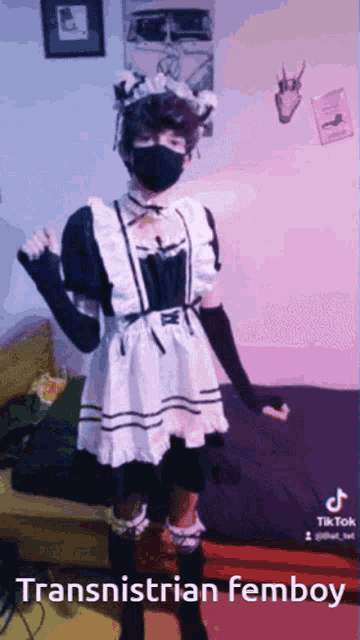 a person dressed in a maid costume with the words transnistrian femboy on the bottom