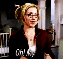 a woman wearing glasses and a necklace says oh my