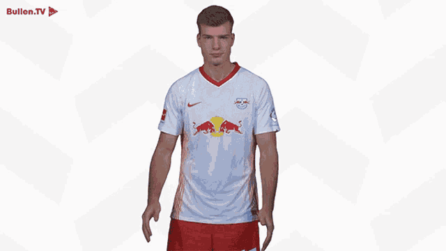 a soccer player wearing a bullen.tv jersey makes a thumbs up gesture