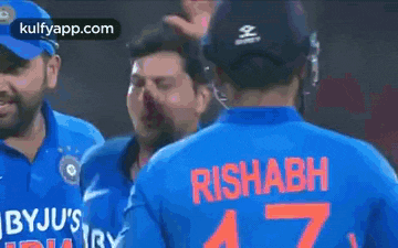 a man wearing a blue shirt that says bbyju 's india