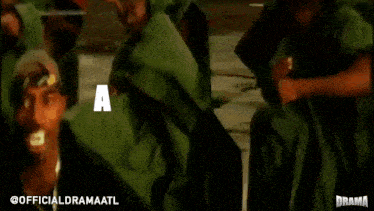 a group of people wearing green shirts with the words a-t-l-a-n-t written on them