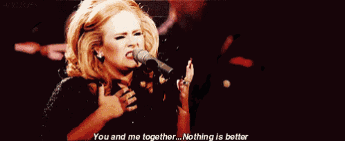 a woman is singing into a microphone and says you and me together nothing is better