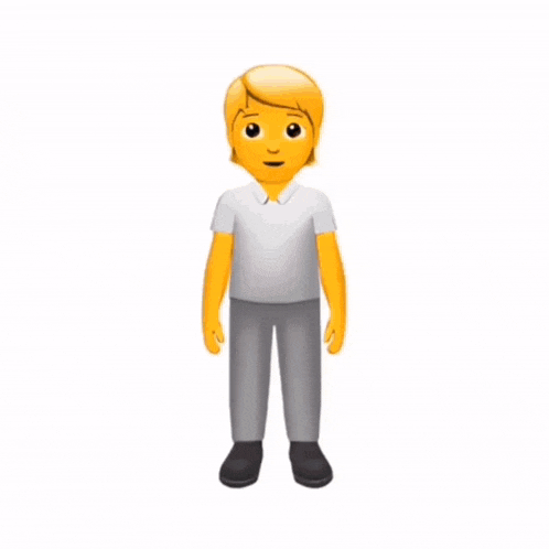 a man in a gray shirt and white shorts stands in a room