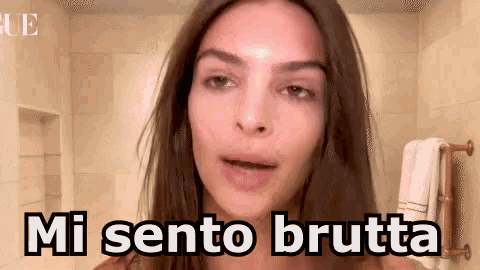 a woman in a bathroom with the words mi sento brutta written on her face