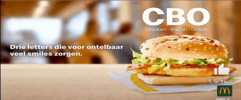 a mcdonald 's chicken bacon onion sandwich with a thumbs up