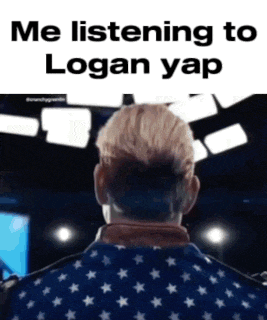 a man in an american flag jacket is listening to logan yap on a stage .