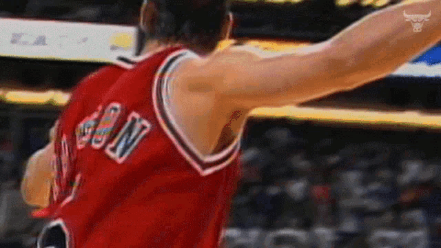 a basketball player wearing a red jersey with the name sun on it