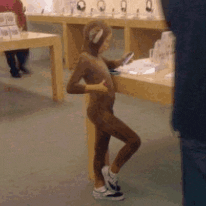 a person dressed in a monkey costume is standing in a store