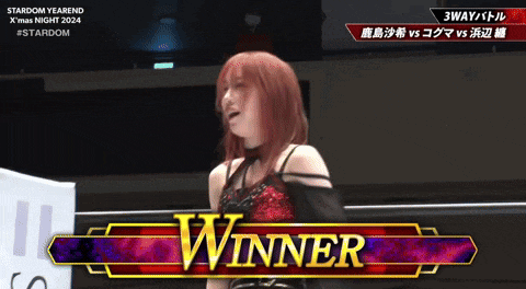 a woman in a wrestling ring with the word winner on the bottom