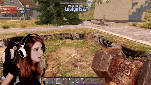a girl is playing a video game with the name lostgirls27 on the screen
