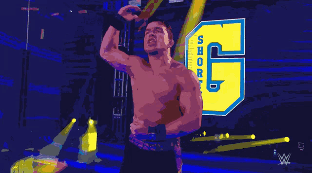 a shirtless man stands in front of a sign that says shorty 6