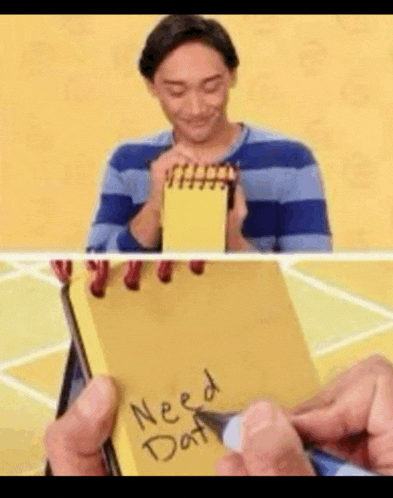 a man is holding a yellow notepad with the words need dat written on it .
