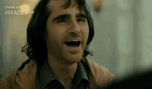 a close up of a man 's face with his mouth open in a movie .