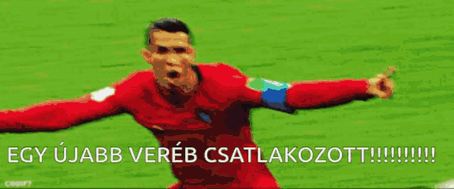 a soccer player in a red jersey is pointing at another player with the words egy ujabb vereb csatlakozott written below him