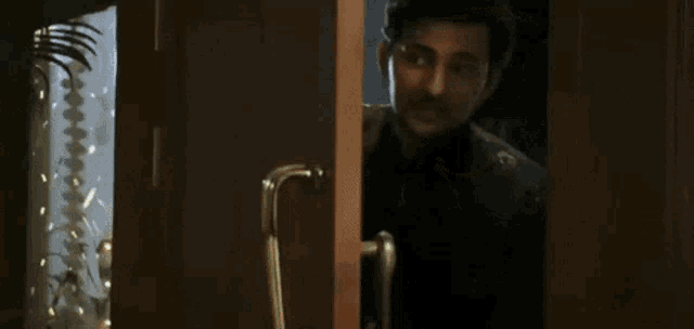 a man standing in front of a door with the words aa ja aa ja aa ja written on the screen
