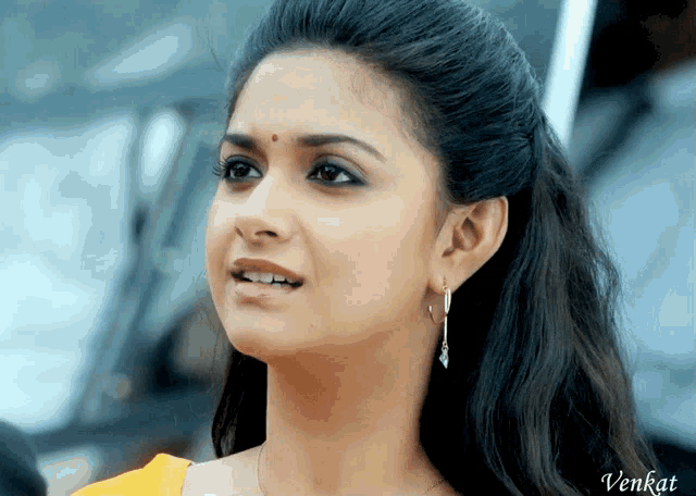 a close up of a woman 's face with the name venkat on the bottom left