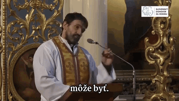 a priest speaking into a microphone with the word moze byt written on the bottom
