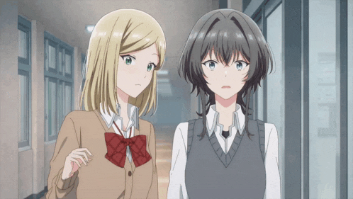 two anime girls are standing in a hallway and one has a red bow on her school uniform