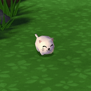 a small white cat is sitting on a green grass field .