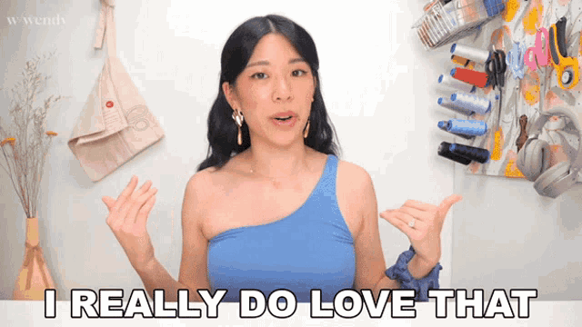 a woman says " i really do love that " in front of a sewing board
