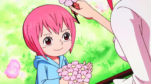 a girl with pink hair is holding a bunch of pink flowers