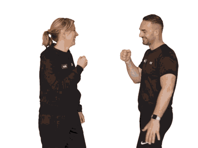 a man and a woman wearing nike shirts