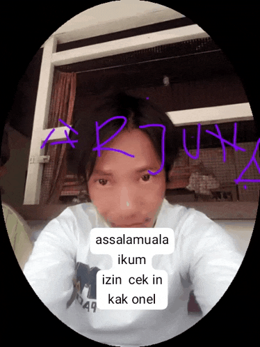 a man taking a selfie with the words assalamuala ikum izin cek in kak onel on his face