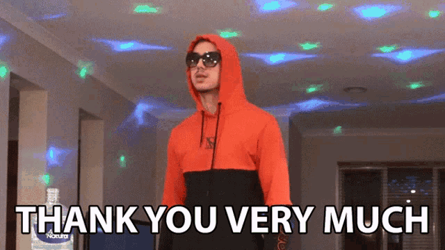 a man in a red hoodie and sunglasses says thank you very much