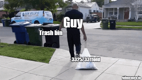 a man walking down a sidewalk with a bag of trash that says guy trash bin