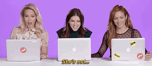 three women are sitting in front of laptops and one of them says she 's not .