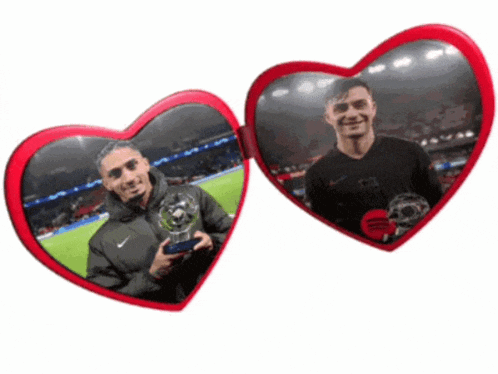 a pair of heart shaped mirrors show two men holding trophies on a soccer field