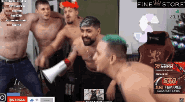 a group of shirtless men are dancing in front of a fine store sign