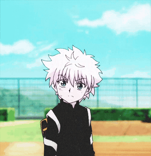 a boy with white hair and blue eyes is standing on a field
