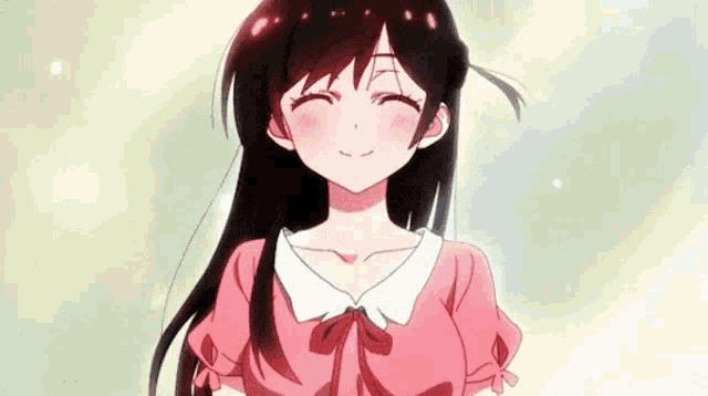 a girl with long black hair is smiling and wearing a pink shirt .