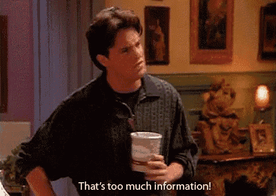 a man is holding a cup of coffee and says `` that 's too much information '' .