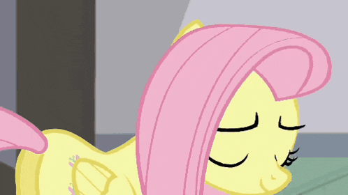 a close up of a cartoon pony with pink hair