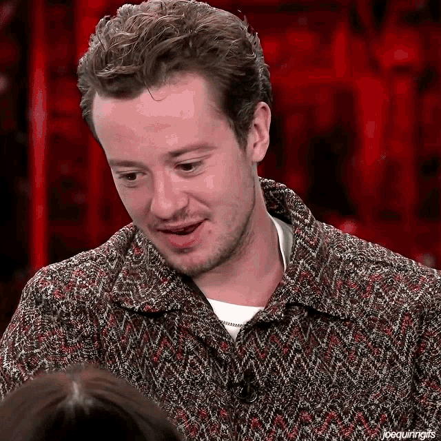 a close up of a man 's face with the words joequiringgifs below it